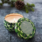 Roland Pine Small Tin Soy Candle on a grey background at Addison West