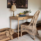 Sconset Writing Table in Limewash Finish in a white room at Addison West