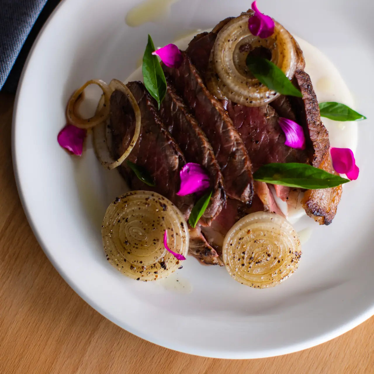 Made In 10.5" Dinner Plate on a table at Addison West