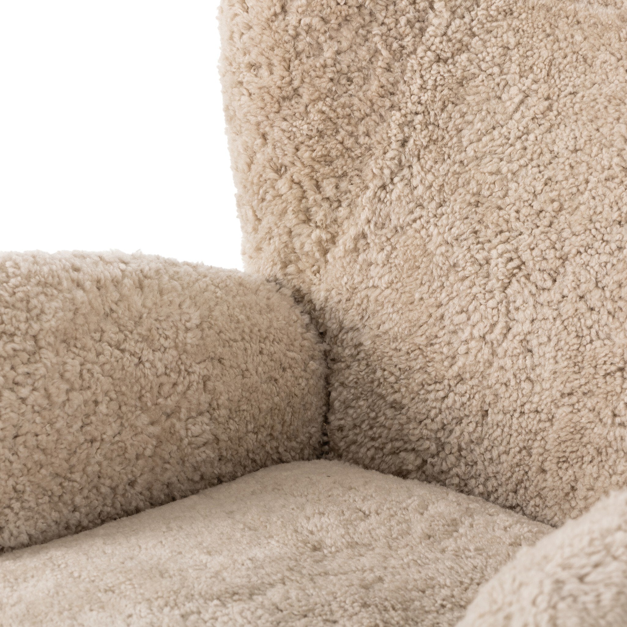 Four Hands Amelie Swivel Recliner in Beige Shearling on a white background at Addison West