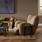 Four Hands Amelie Swivel Recliner in Beige Shearling in a living room at Addison West