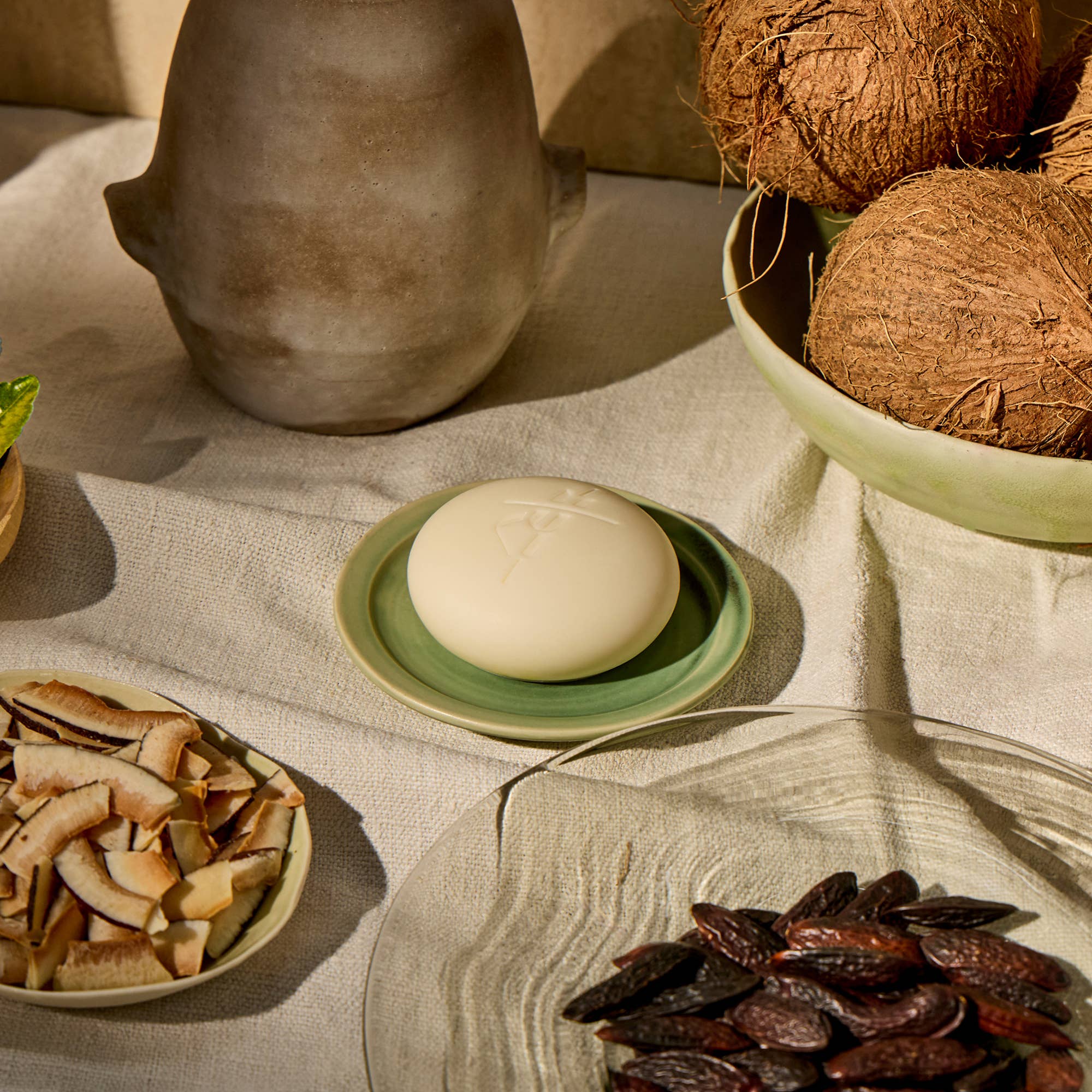 Tonka Bean & Coconut Deep Moisturizing Lotion Bar on table  at Addison West