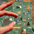Tapestry Garden 1000 Piece Puzzle on a wood background at Addison West