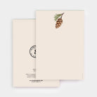 Cream notepad with a Pinecone drawing on top on a white background