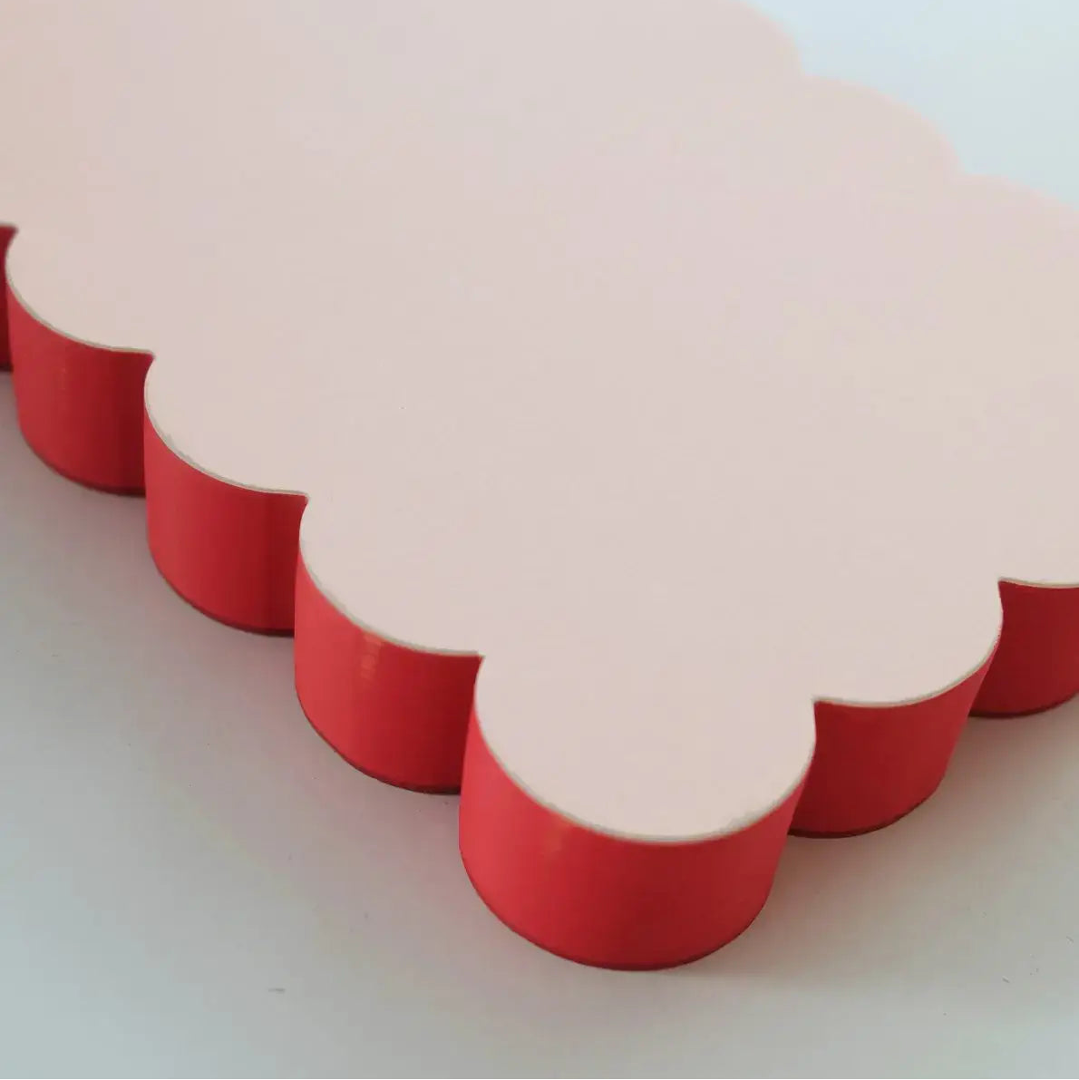 Scalloped Shaped Notepad in Peach And Persimmon on a beige background at Addison West
