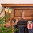 East End Press Christmas Sewn Garland on a fireplace at Addison West