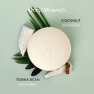 Tonka Bean & Coconut Deep Moisturizing Lotion Bar on a blue background at Addison West