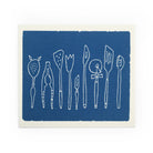 Swedish cloth sponge with kitchen utensils in a row and blue background