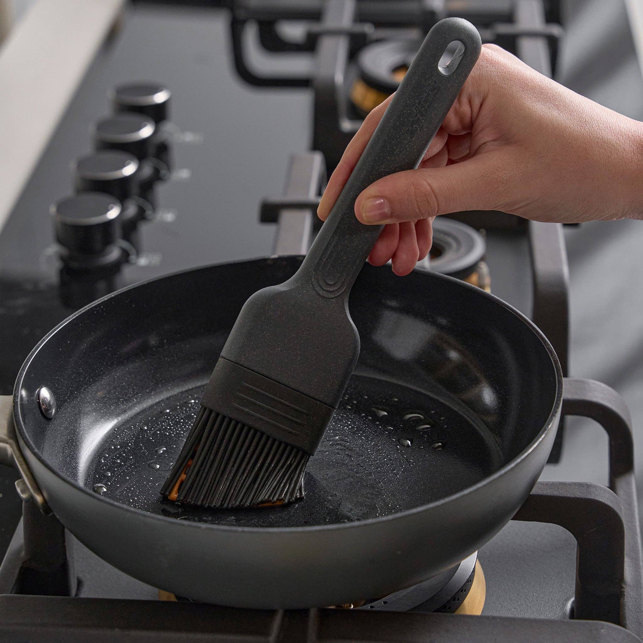 Silicone Basting Brush being used by a chef at Addison West