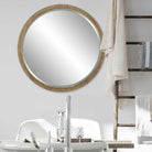 Parnell Round Accent Mirror on a white wall in a bathroom at Addison West