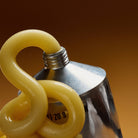 Honey Depot Tube of Honey on a beige background at Addison West