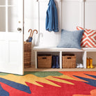 Greylock 22" Square Indoor/Outdoor Pillow on an entry bench at Addison West