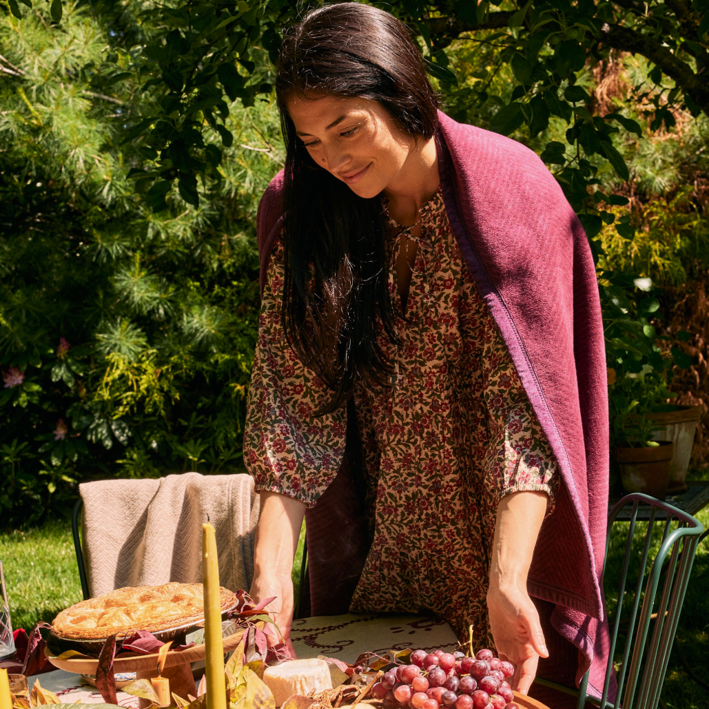 ChappyWrap Harborview Herringbone Blanket in Plum on a model at Addison West