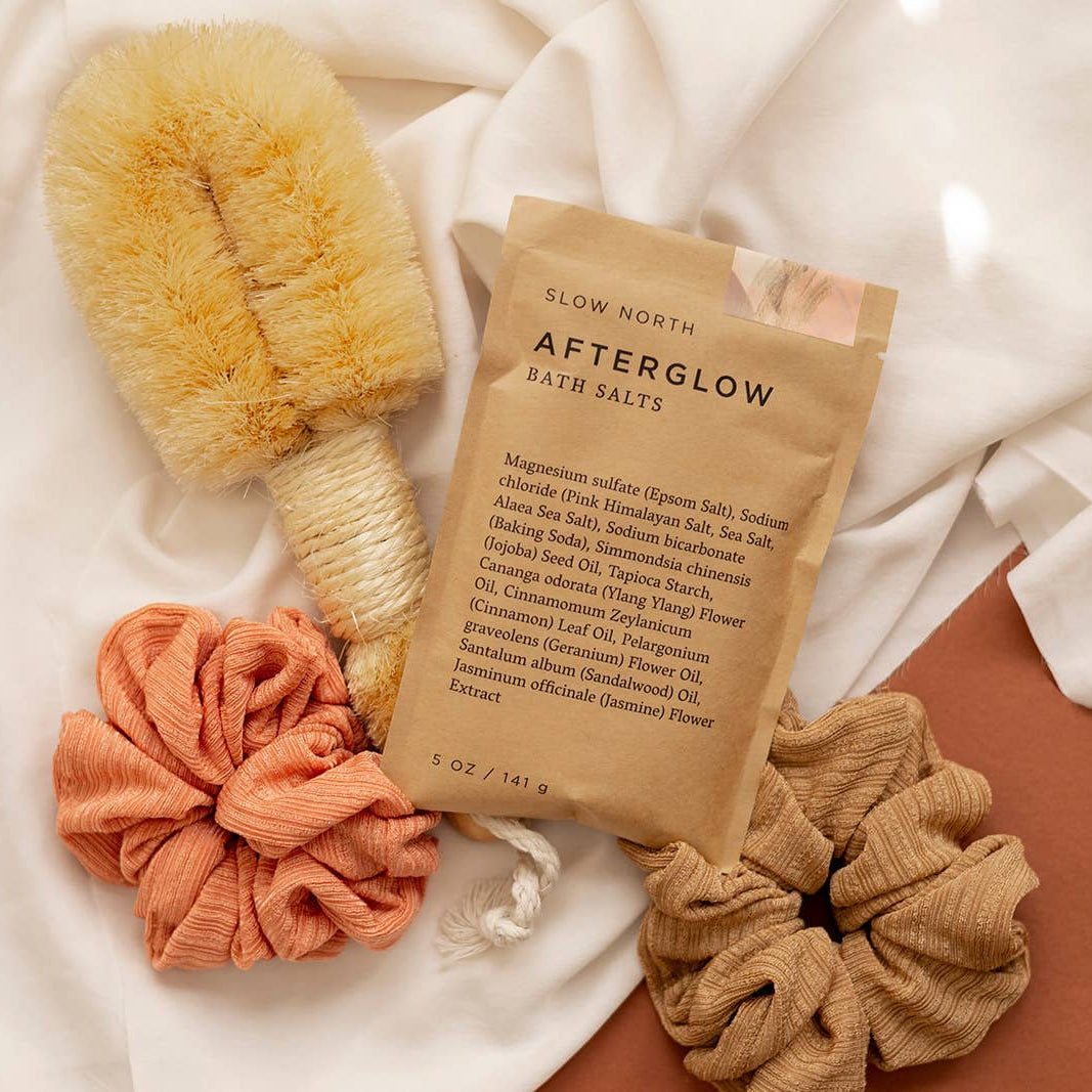 Afterglow Bath Salts in an orange background at Addison West