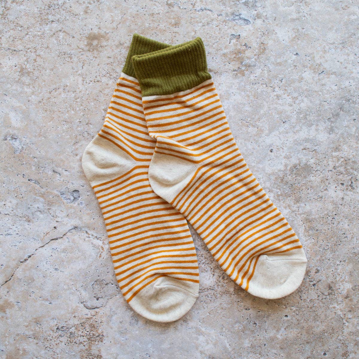 Stripe Socks in Olive and Oatmeal on a beige background at Addison West