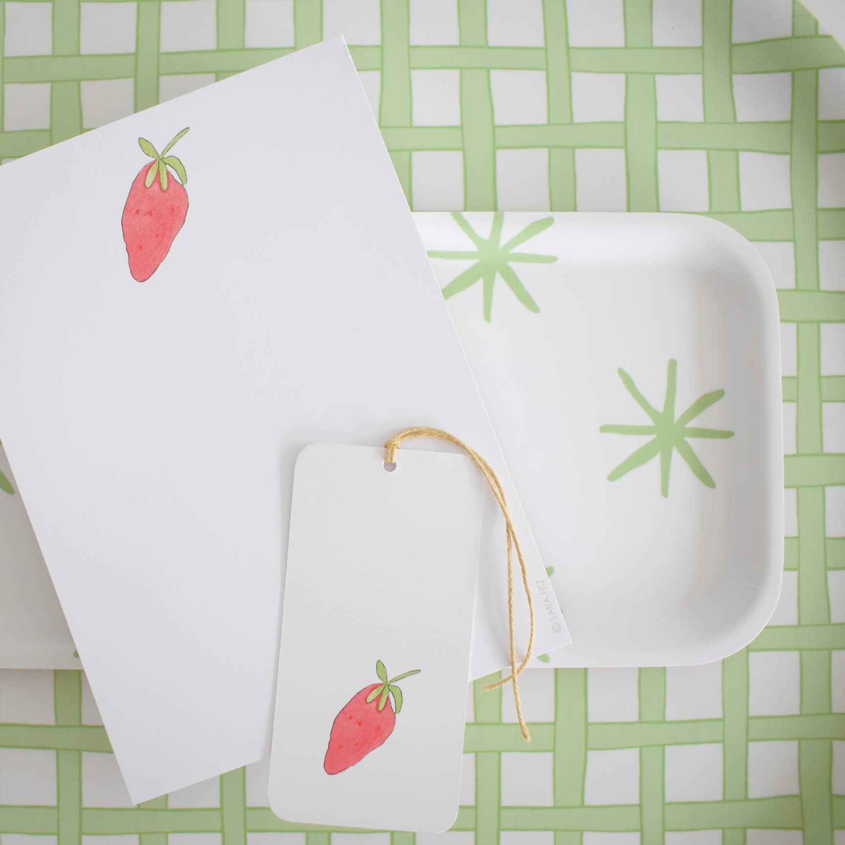 Strawberry Notepad on a table at Addison West