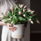Farmhouse Pottery Silo Medium Crock with flowers held by a model at Addison West