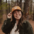 Barn Owl Corduroy Hat in Amber on a model outside at Addison West
