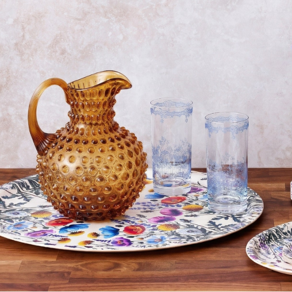 Hobnail Glass Pitcher in Honey Gold on a table at Addison West