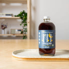 Organic Dark Maple Syrup on a table  at Addison West