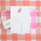 Strawberry Notepad on a table at Addison West