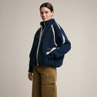 Contrast Trim Sherpa Zip-Up Jacket in Navy on a model at Addison West