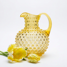 Hobnail Glass Pitcher, Limoncello on a white background at Addison West