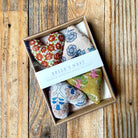 Mini Lavender Heart Sachets, Set of 4 on a wood table at Addison West