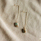 Commonform Aurora Earrings in Turquoise on textured background at the Addison West.