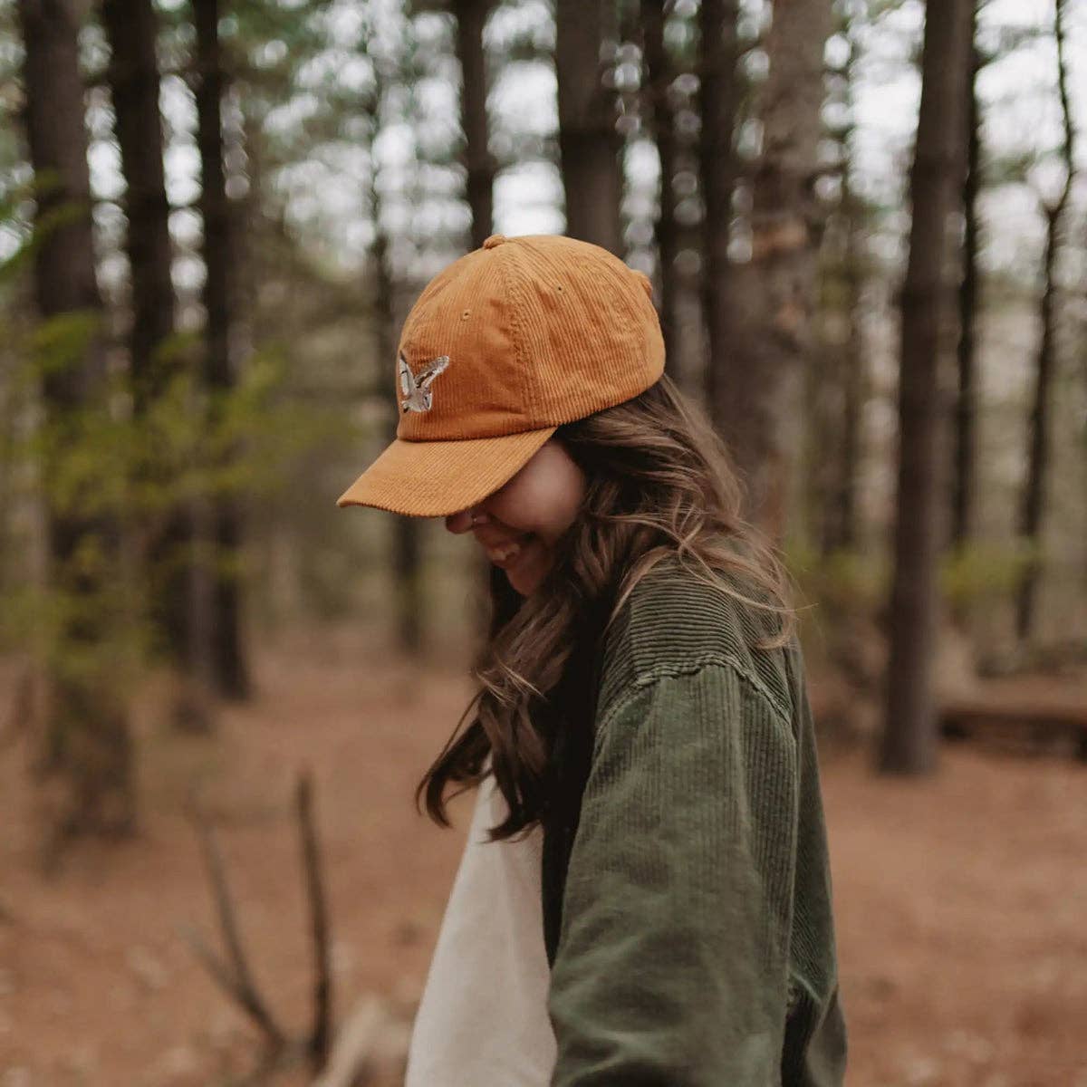 Barn Owl Corduroy Hat in Amber on a model outside at Addison West