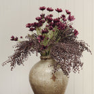 Calliopsis Spray in Deep Purple on a beige background at Addison West