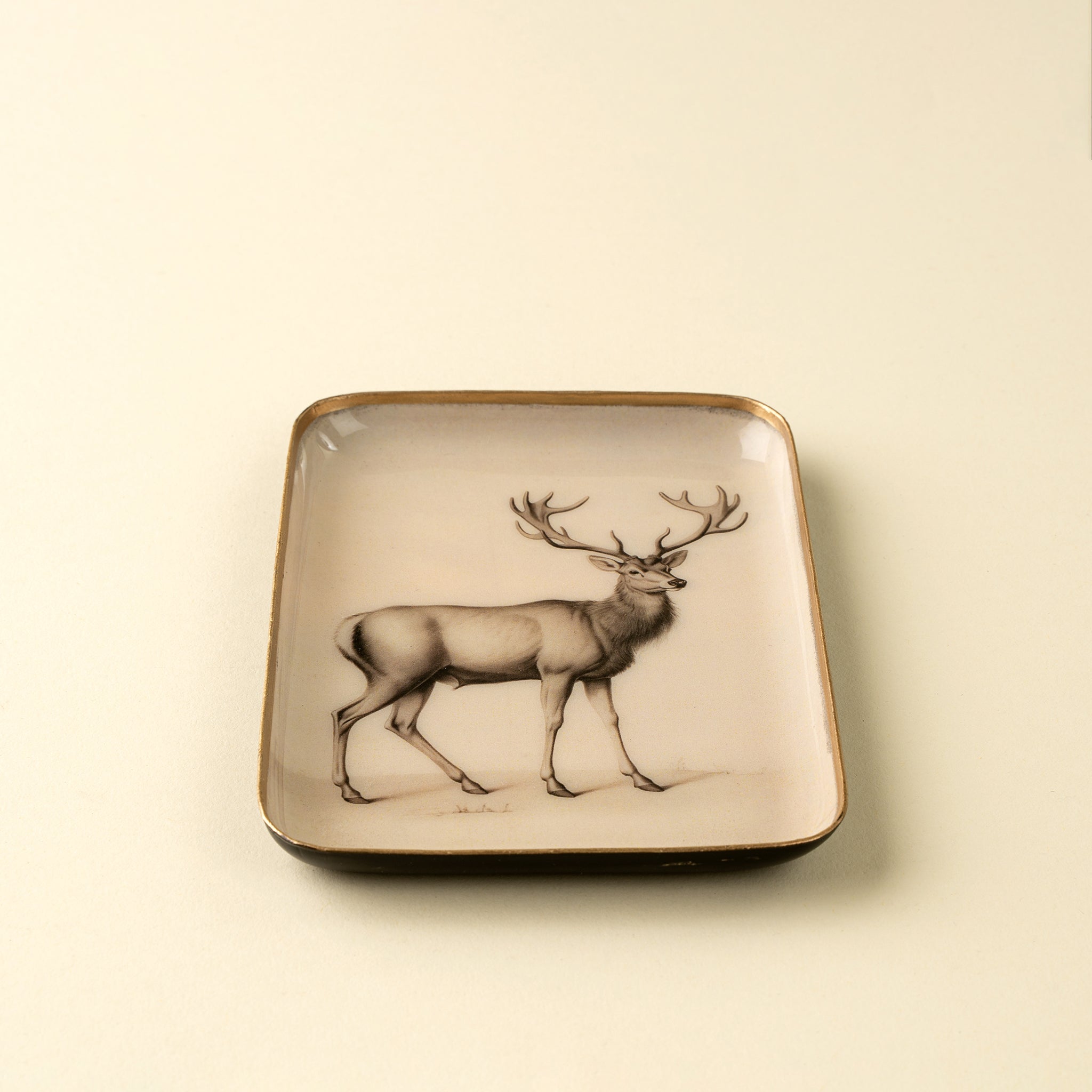 Woodland Stag Enameled Tray on a beige background at Addison West