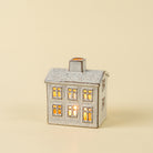 Small Winter Chalet Tealight House on a beige background at Addison West