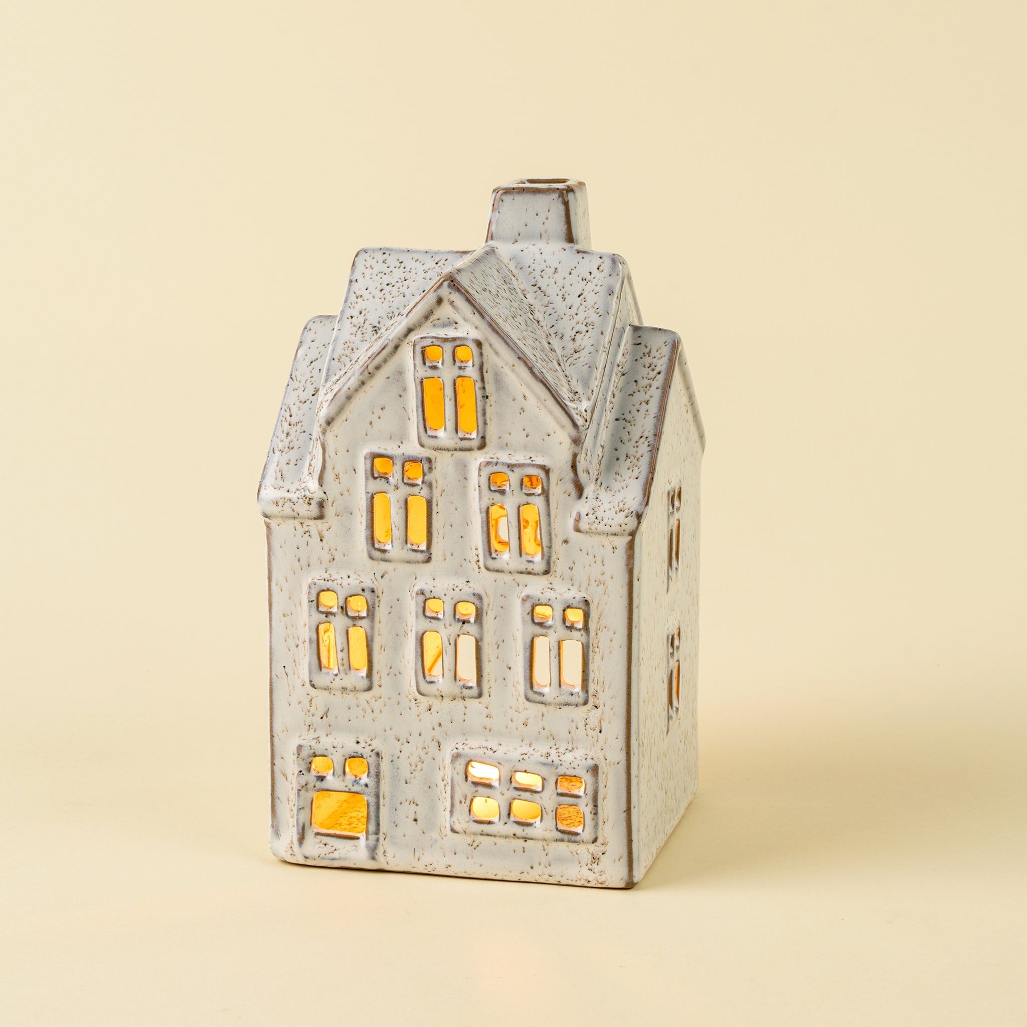 Large Winter Chalet Tealight House on a beige background at Addison West