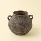 Small Artifact Stoneware Vase on a beige background at Addison West