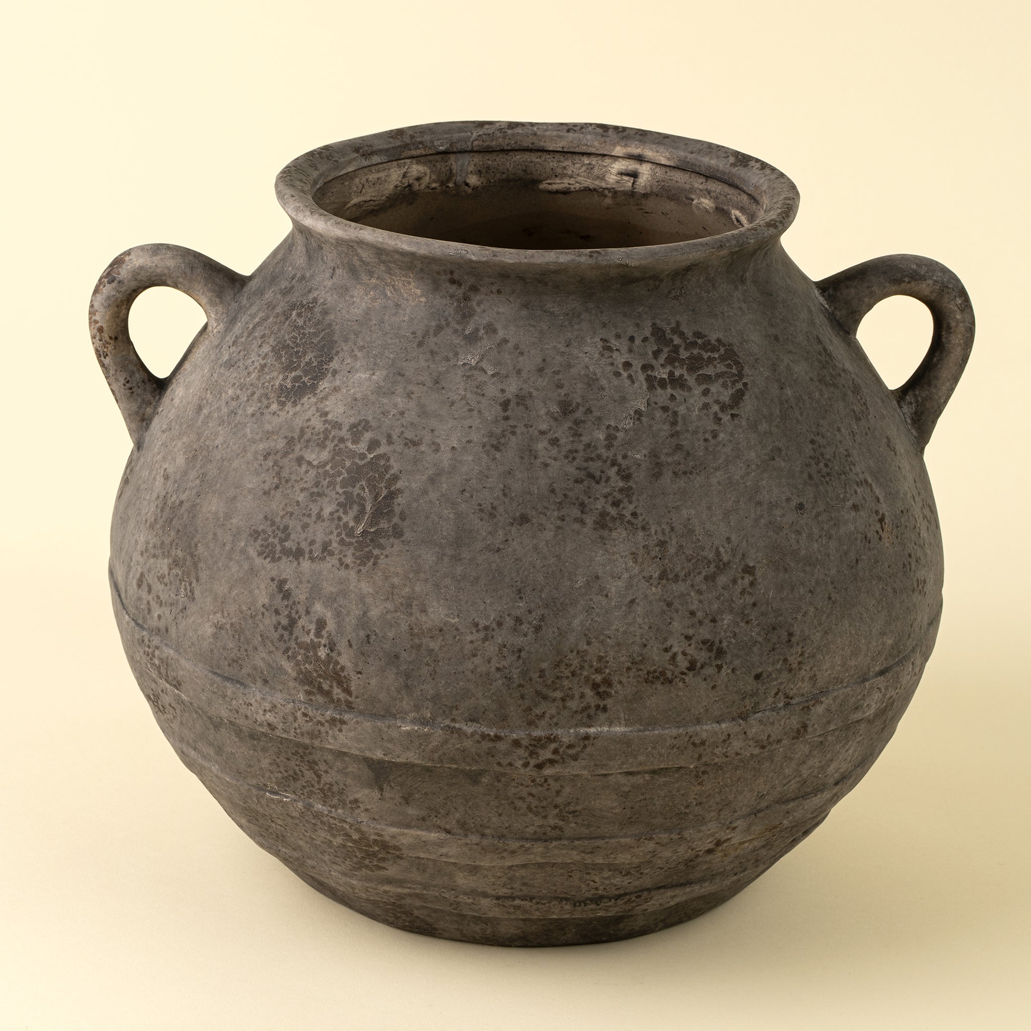 Large Artifact Stoneware Vase on a beige background at Addison West