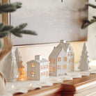 Cedar Snowdrift Ceramic Tree on a mantel at Addison West