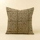 Decorative pillow with floral pattern on a beige background