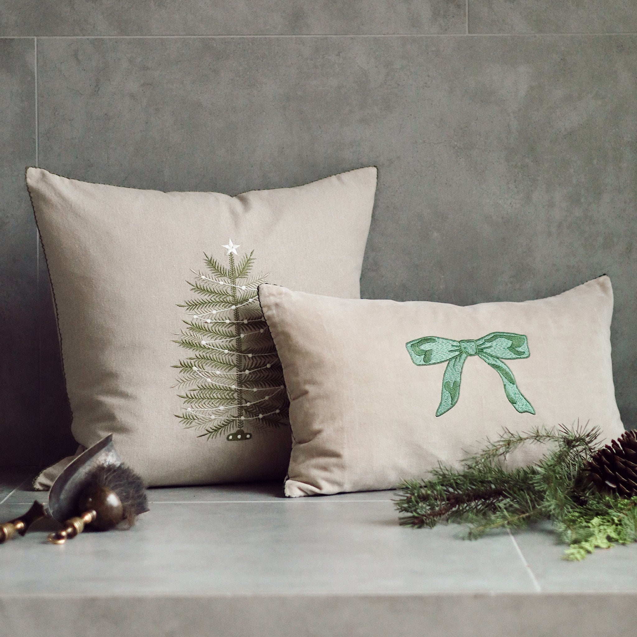 Embroidered Tree Pillow 20" x 20" on a grey background at Addison West