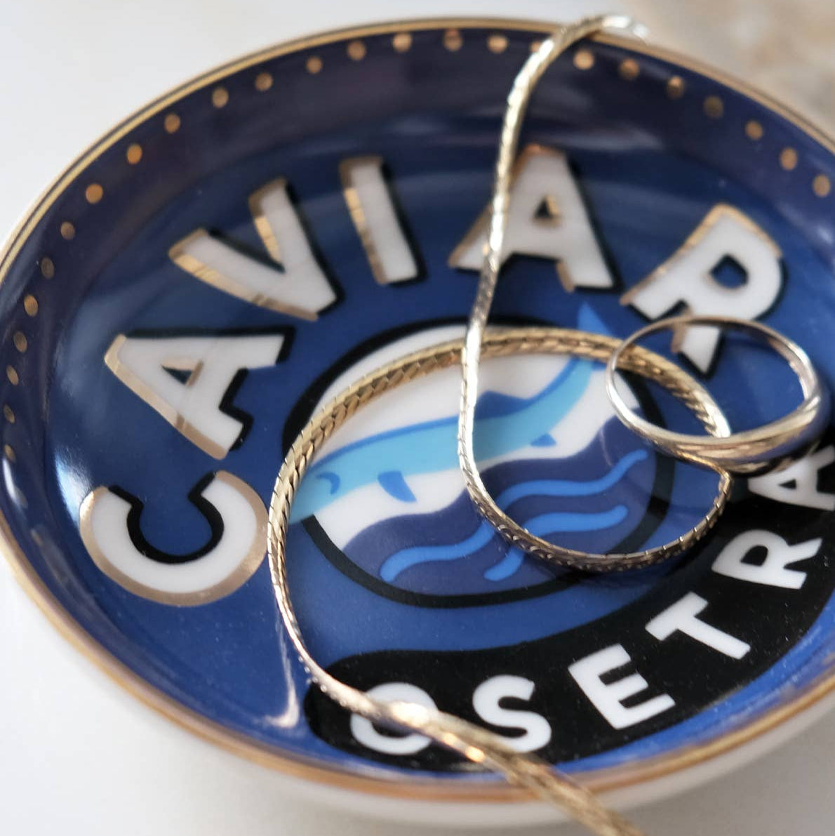 Caviar Trinket Dish on a beige background at Addison West