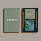 Scrabble Grand Folding Edition on a green background at Addison West