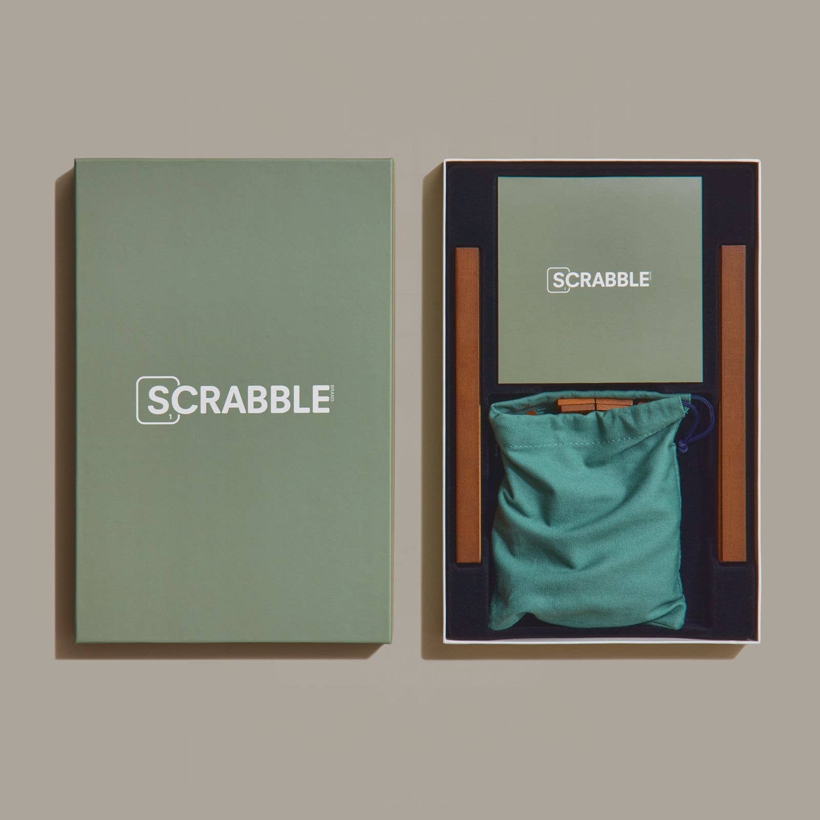 Scrabble Grand Folding Edition on a green background at Addison West