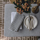 Olive Gingham Check Linen Tablecloth, 60" x 90" on a table at Addison West
