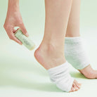 Solemate Heel Repair Balm in Mint on a green background at Addison West