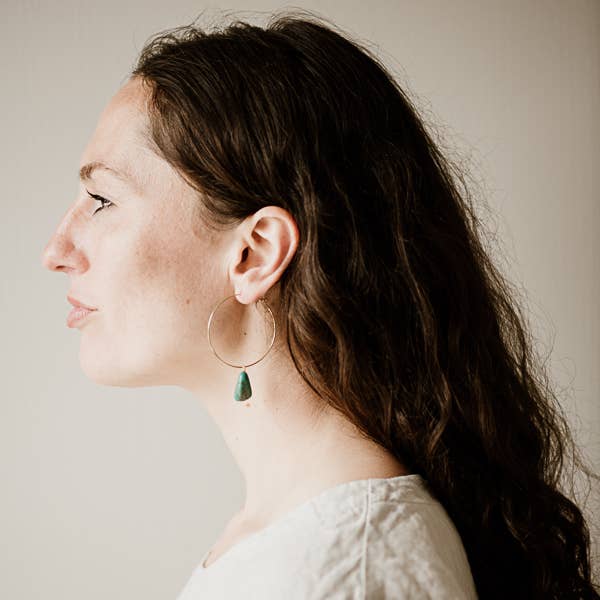 Commonform Aurora Hoops in Turquoise on model against plain background at the Addison West.