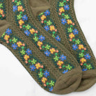 Aahana Floral Socks in Olive on a white background at Addison West