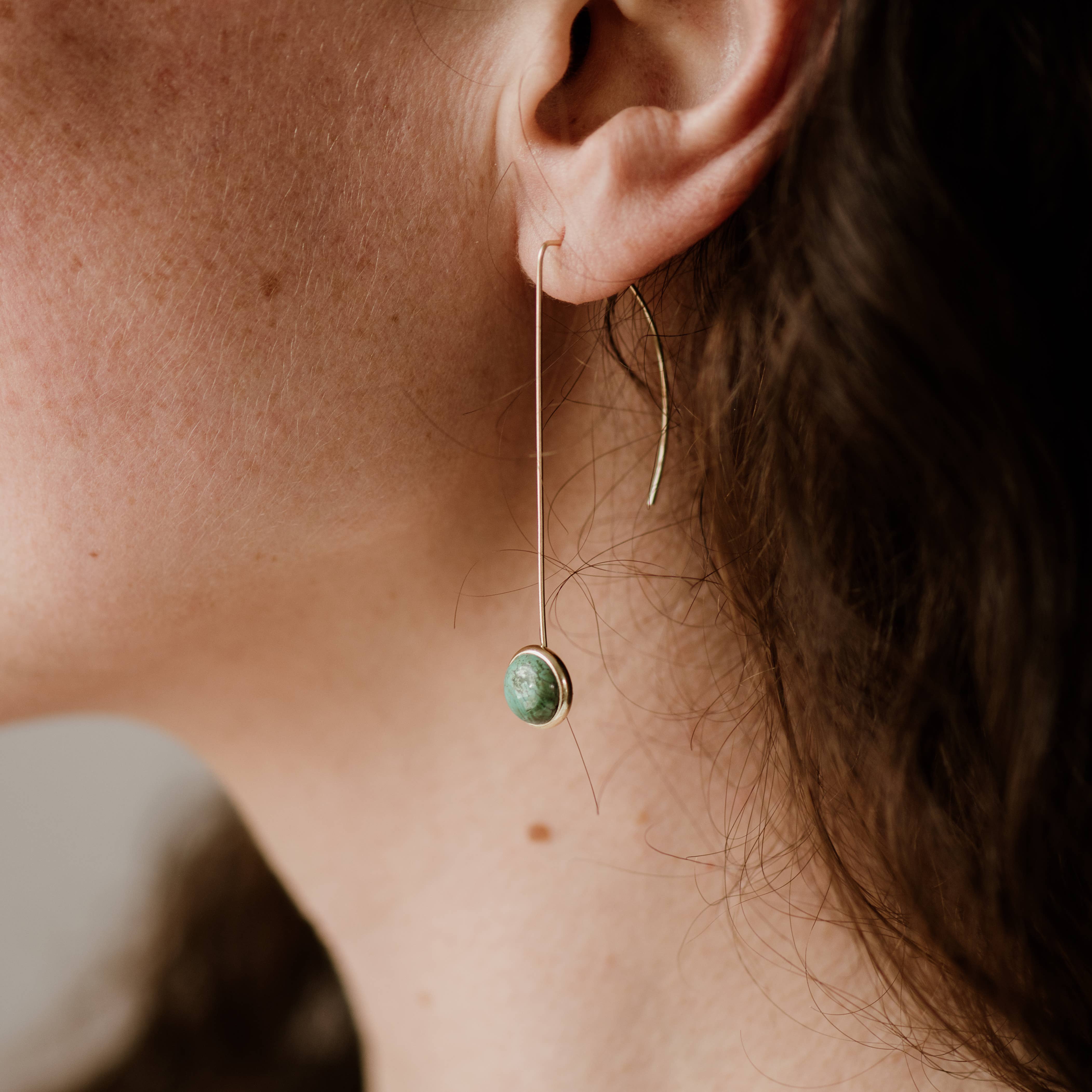 Commonform Anther Drops in Turquoise on model at the Addison West.