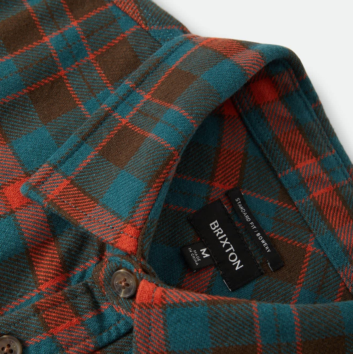Brixton Men's Bowery Flannel in Walnut Brown & Ultra Marine on plain background.