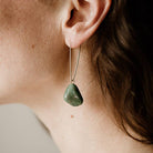 Commonform Aurora Earrings in Turquoise on model at the Addison West.