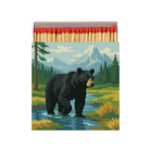 Matchbox with a bear design on a mountain landscape